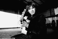 Oasis donate signed guitar to Manchester grassroots music art trail and auction